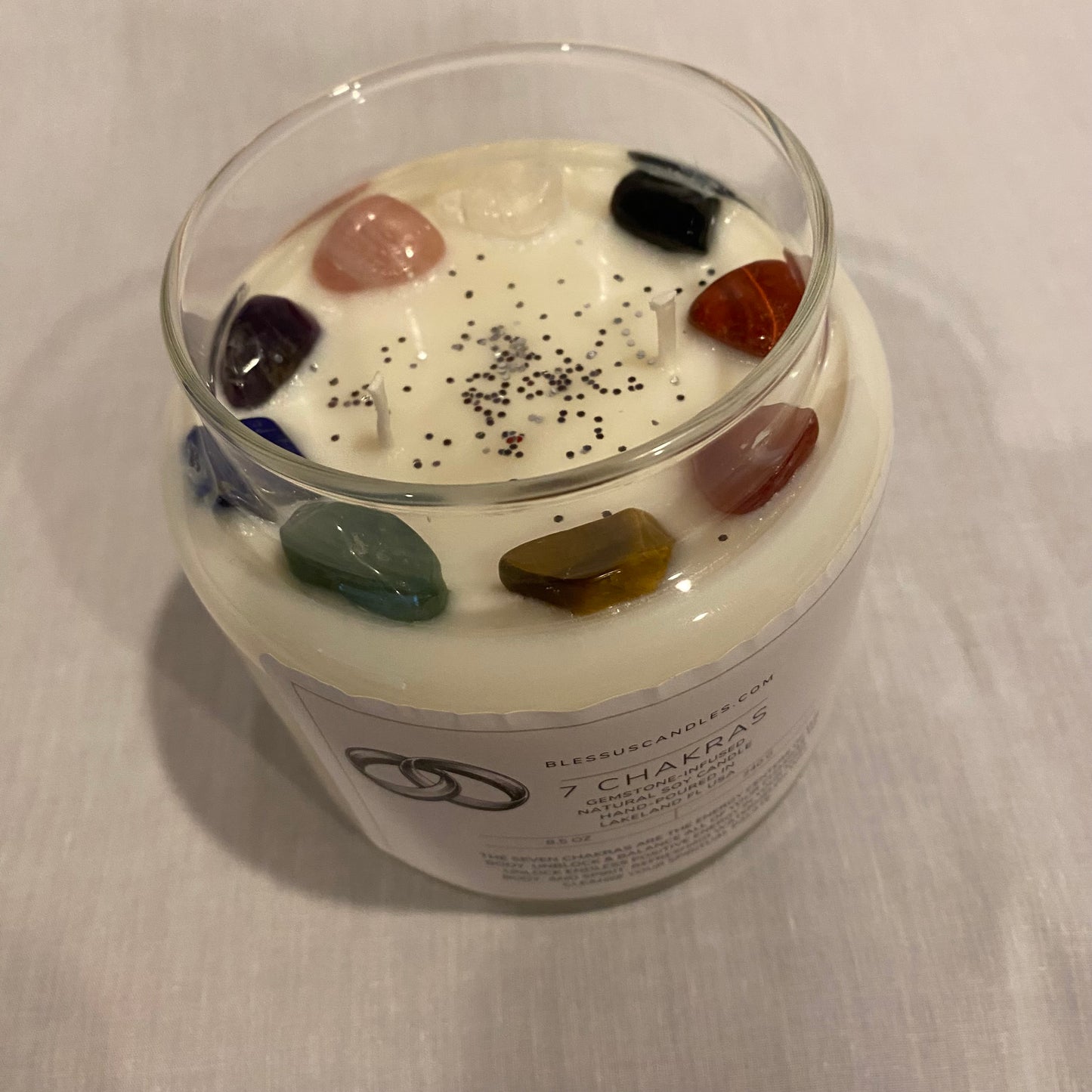 Gemstone candle infused with gems for all seven chakras. 16oz glass jar.